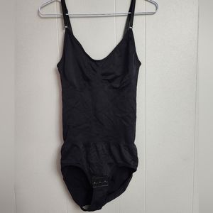 Black shape wear bodysuit new never worn but removed the tags.
